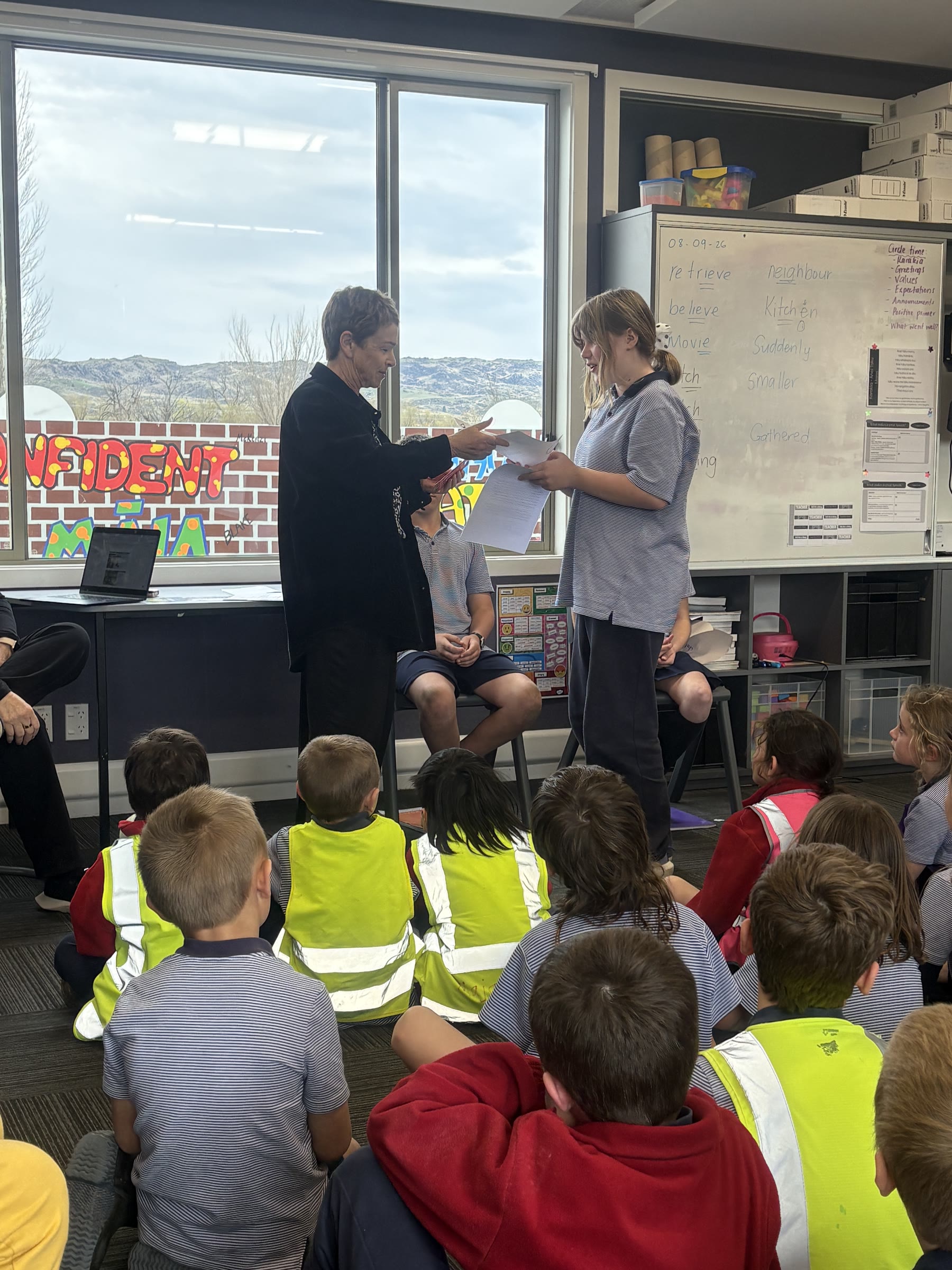 Emma Bartlett receiving her award during a school assembly at Omakau Primary School